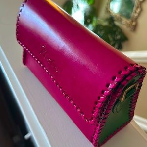 It’s an Artisans Purse -Nila. Pretty Pink and Green structured leather.
